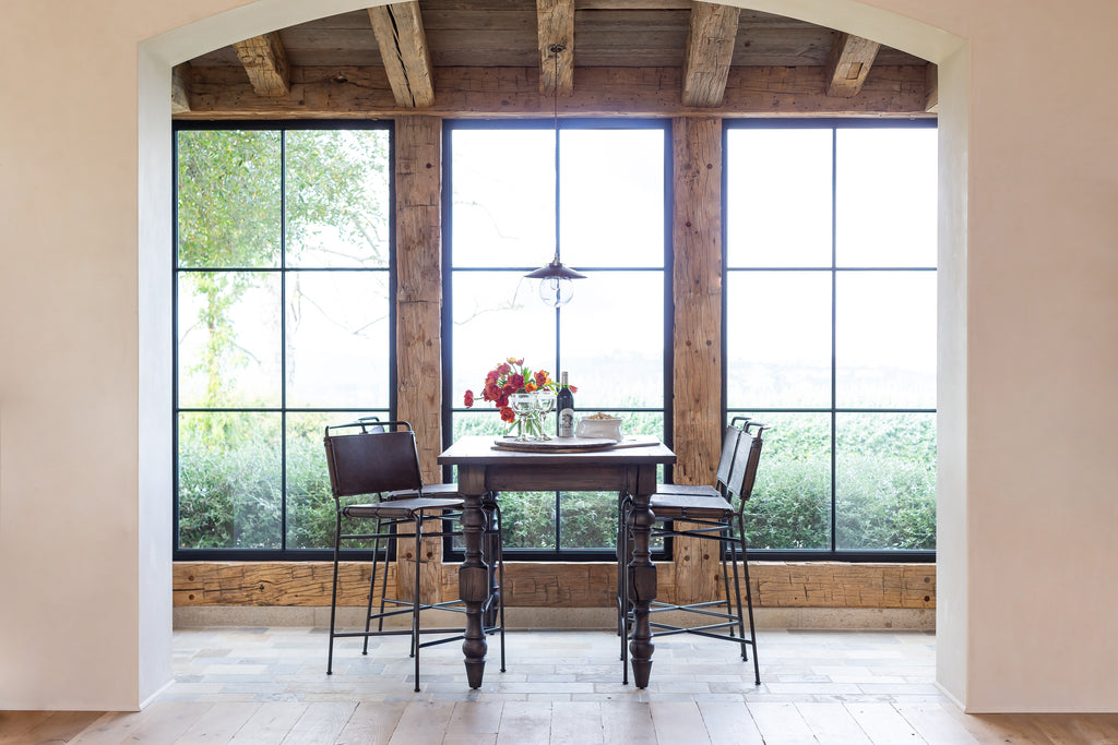 Leather and Metal Counter Stool Styled at Bistro Table in Home